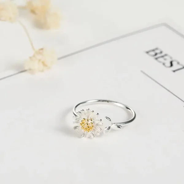 Adjustable silver daisy flower ring with gold center, perfect for women